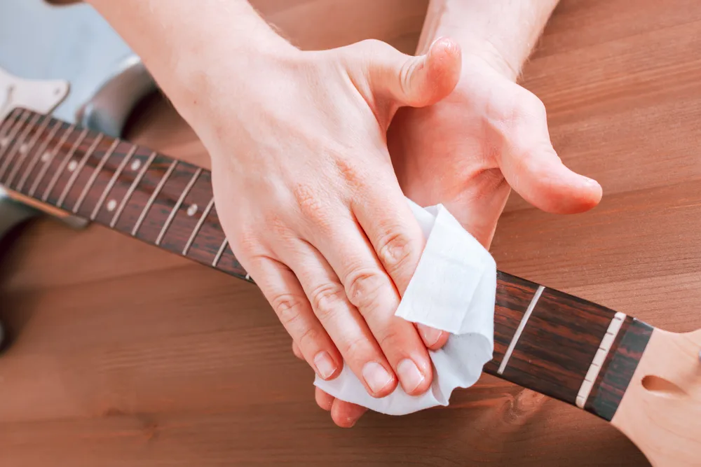 how to clean guitar fretboard